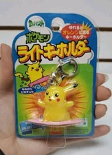 1999 Tomy: Light-Up Surfing Pikachu Keychain - Brand New *READ*