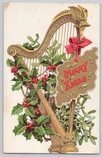 Muskegon, Mich, Christmas harp with holly and mistletoe, Divided Back — 1910