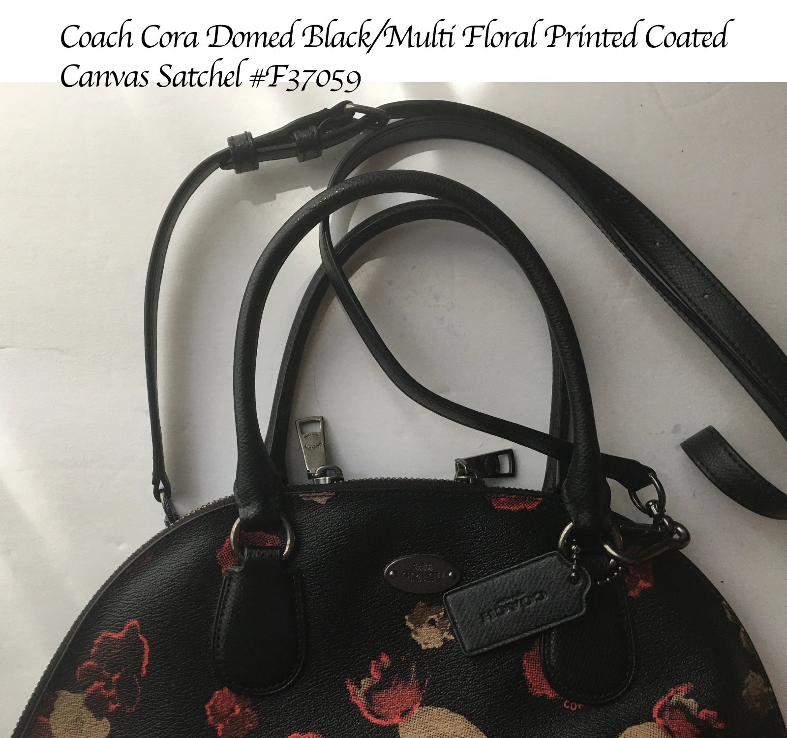 Borsa Coach Cora. U Ottime condizioni. Tela nera multi stampa floreale