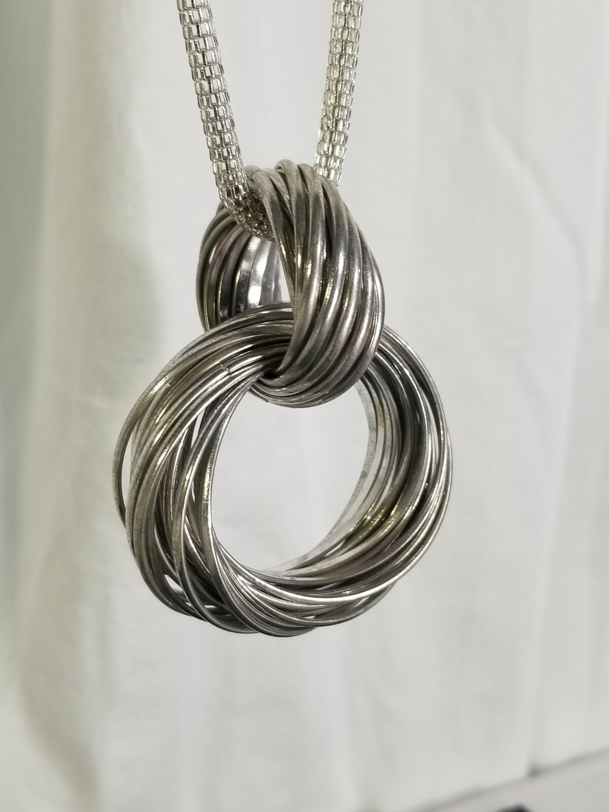 Silver Tone Metal Interlocking Infinity Knot Stat… - image 4