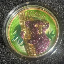 1oz silver/gold maple with a silver bejeweled koala with Swarovski crystals 