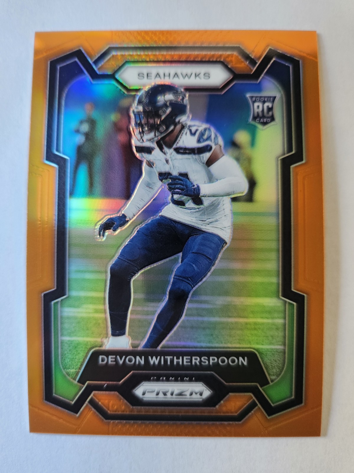 2023 Panini Prizm Rookies Devon Witherspoon #389 Orange Prizm /249 (RC) Seahawks