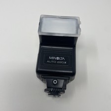 Minolta Auto 220X Universal Shoe Mount Camera Flash With Plastic Cover