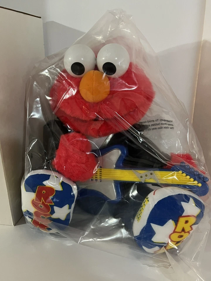 Guitarra de peluche Rock N Roll Elmo toca música canta y agita 1997 Avon primer lanzamiento Foto 2 de 4