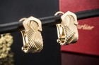 Cartier Ohrringe C de Cartier Clip Ohrstecker geflochten in Gelbgold 750 Schmuck