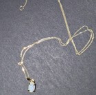 9ct Yellow Gold thin necklace and natural opal pendant fully Hallmarked