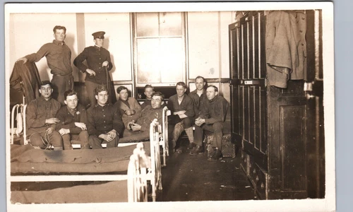 WW1-ERA SOLDIERS IN A ROOM real photo postcard rppc fort camp war military