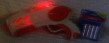 10 to 11 Glowing Loud Noise Making Orange and White Laser Toy Gun New AAs