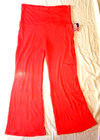 Bright pink women’s yoga pants, size 2X, with wide waistband, stretch, and small American flag on left thigh.