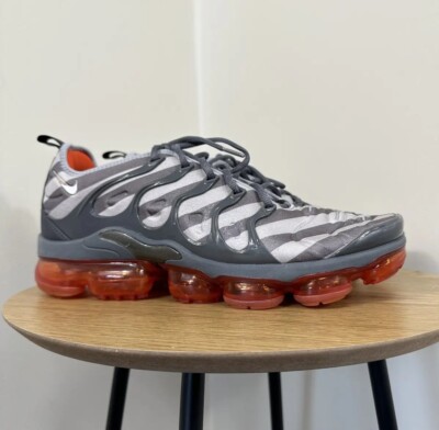 grey and orange vapormax plus