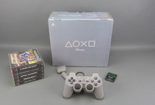 Console SONY PLAYSTATION ONE, 2 manettes + 1 CM + 5 jeux de coop.