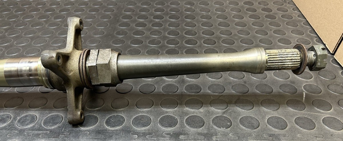 03-07 Suzuki LTZ400 REAR AXLE WITH HUB AND CASTLE AND LOCK NUTS