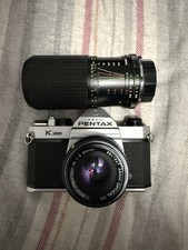 Pentax K1000 With 50mm f2.0 and 75-200 Macro Zoom.