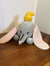 Disney Dumbo 17-in plush featuring yellow hat, large ears, and magic feather