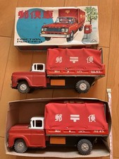 Two intage tin friction postal trucks