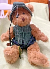 "Let's go fishing" bear in plaid shorts and green vest and hat, fishing pole