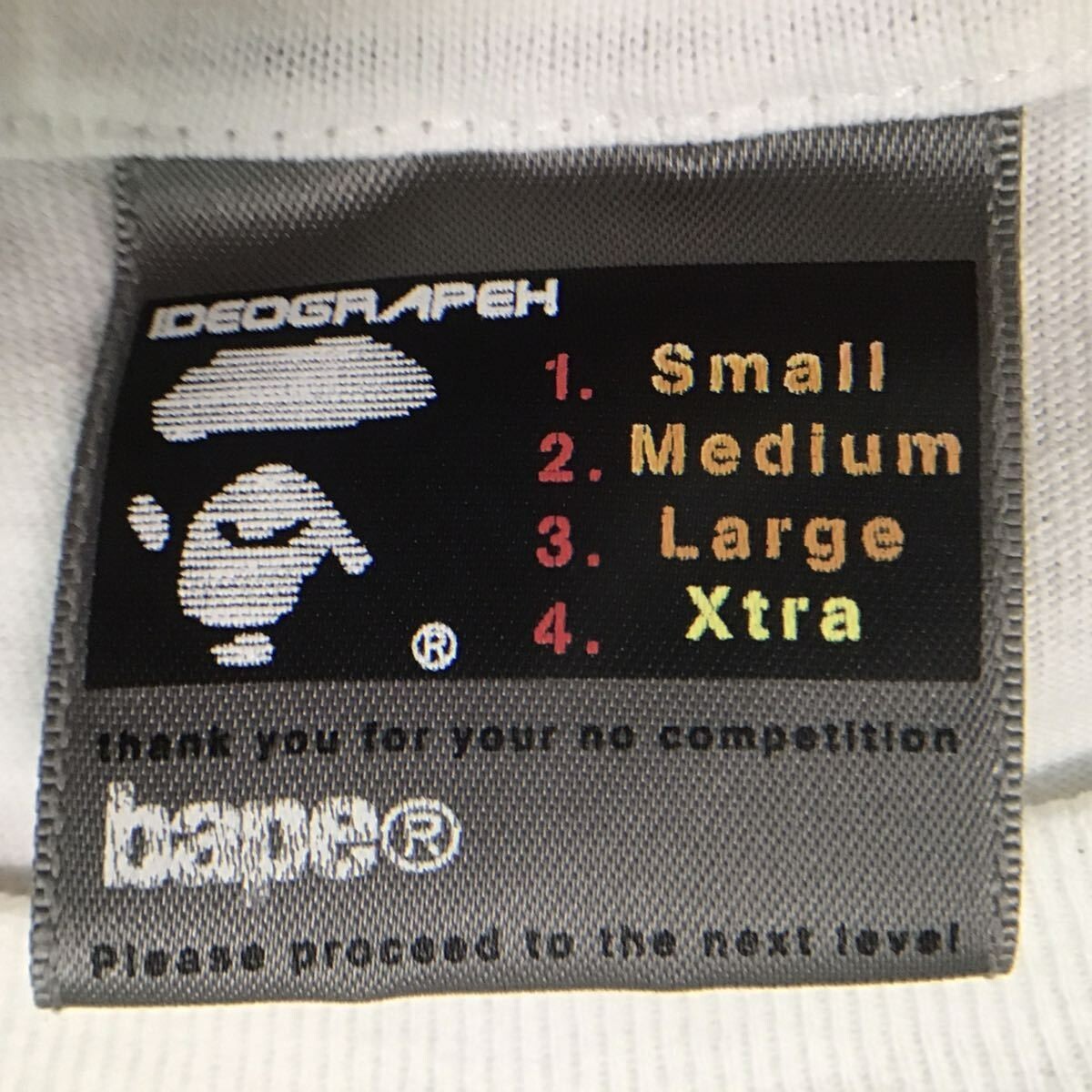 BAPE × N.E.R.D collaboration T-shirt White NERD A Bathing BAPE × N.E.R.D collaboration T-shirt White NERD A Bathing