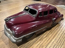 Vintage SSS Japan 1940s-50s Tin Friction Baby Cadillac Maroon with Brown Bottom