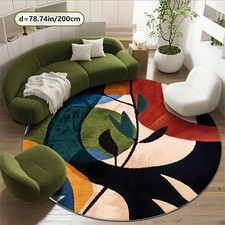A Beautiful Round Carpet with a Modern Multi-Color Pattern And a Soft Plush Feel