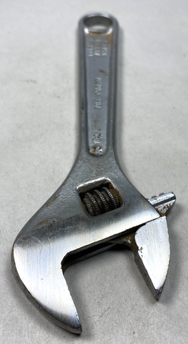 Silver 6-inch adjustable crescent wrench with worn handle, yellow “Proto Tools No. 706 Made in U.S.A.” text.
