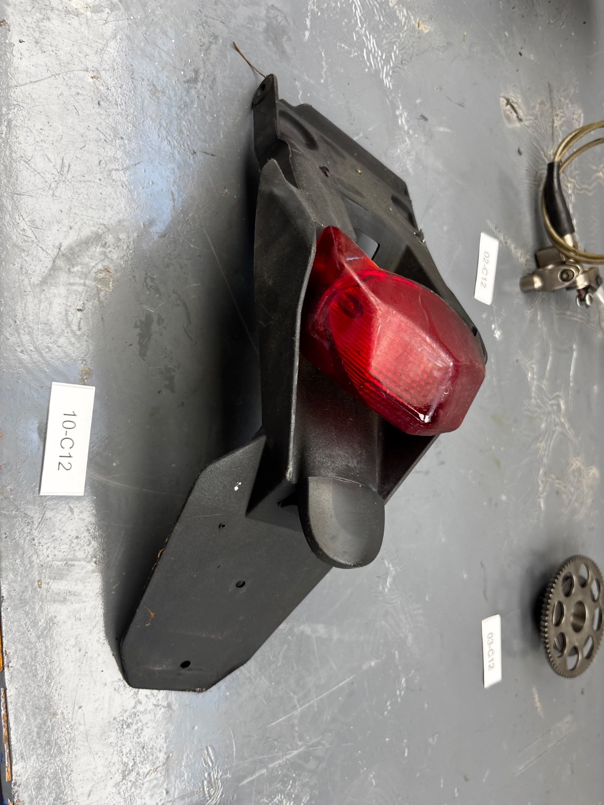 PORTATARGA ORIGINALE CON FARO HUSQVARNA SM WRE 125 98-2013