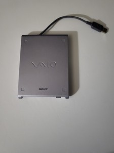 Sony VAIO PCGA-UFD5 portable external USB floppy disk drive.