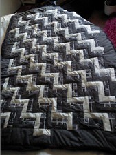 patchwork quilt and two pillows