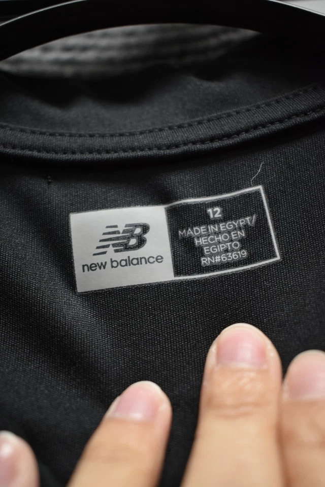Polo Dri Fit negro para jóvenes New Balance talla 12 Foto 3 de 3