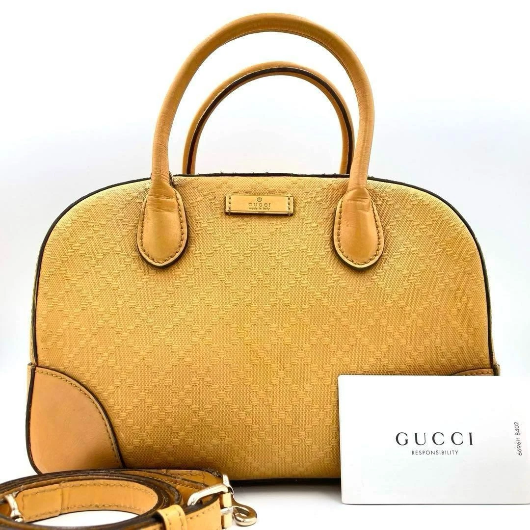 Mini sac Boston GUCCI 2 voies logo intégral cuir gaufré jaune 75154K authentique