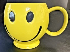 Yellow Smiley Face Coffee Mug - Feed the Day - Corner Bakery Cafe, 3 3/4" high