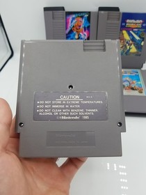 NES Games Bundle Of 4 Ikari Warriors 2 Tecmo Bowl Bionic Commando Winter Games