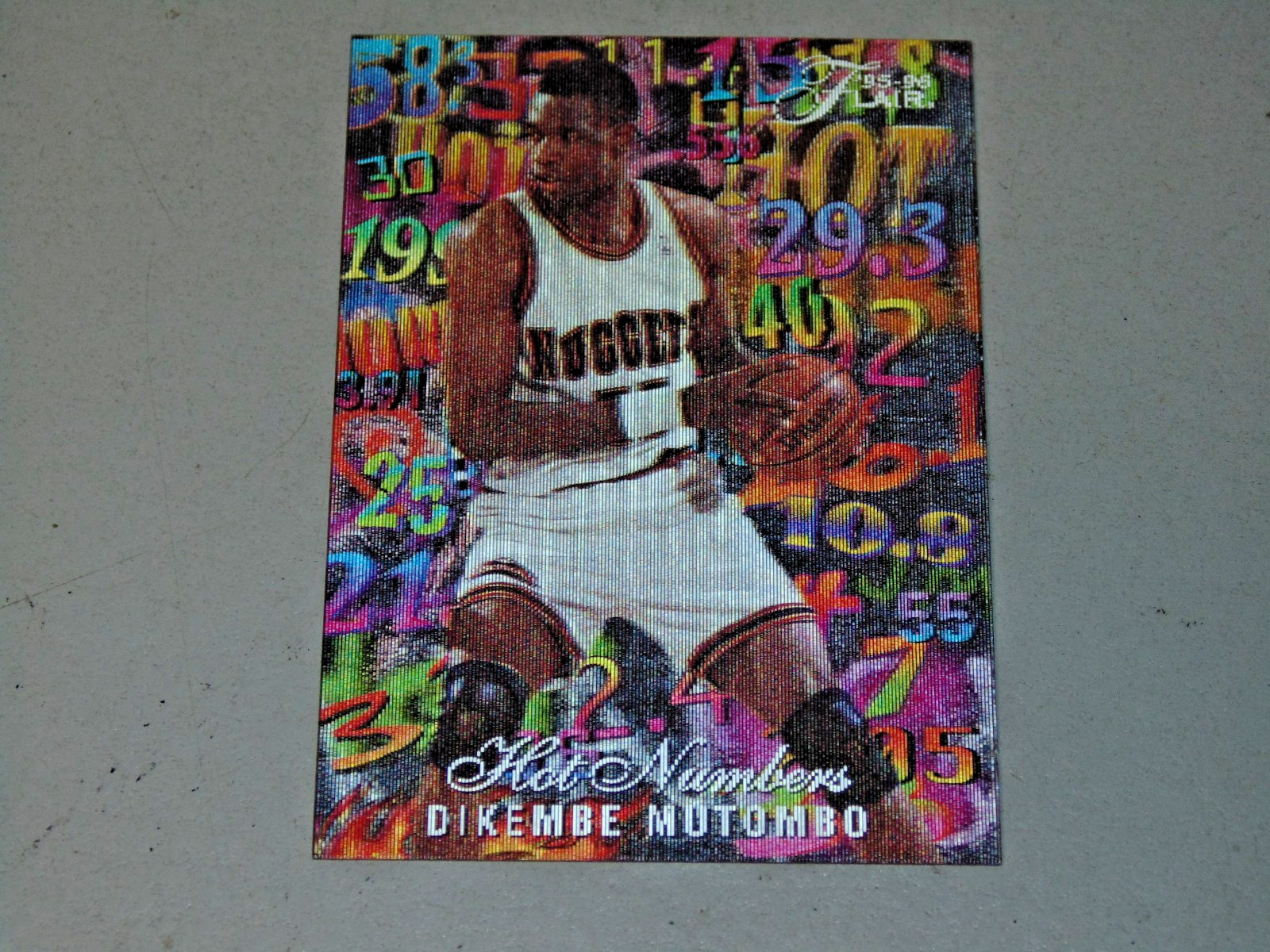 1995-96 Flair - Hot Numbers Dikembe Mutombo #9