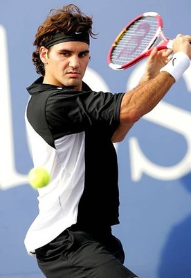 Roger Federer of Switzerland returns to Marat Safin of Russia duri- Old Photo