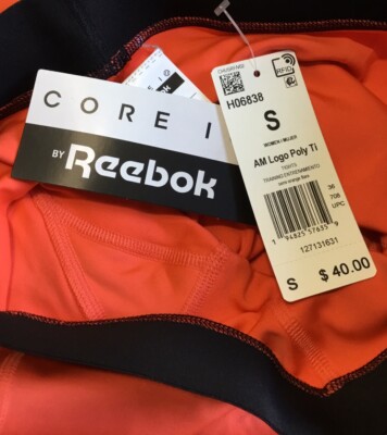 Reebok Core I Training Tights Women s Size Small Orange Flare Spell Out Logo