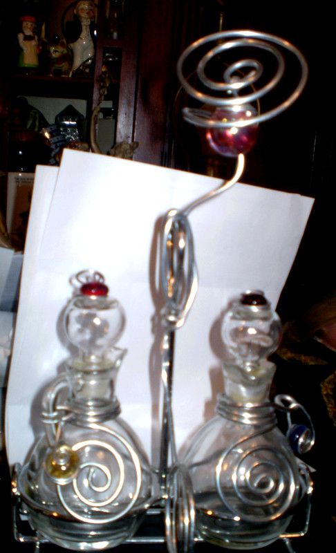 Dary Rees oil and vinegar cruet set with decorative wire holder artistic style