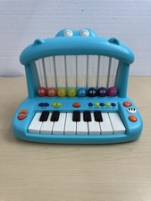 B. Toys Hippo Pop Musical Toy Keyboard Play Piano Songs Sounds Lights Instrument