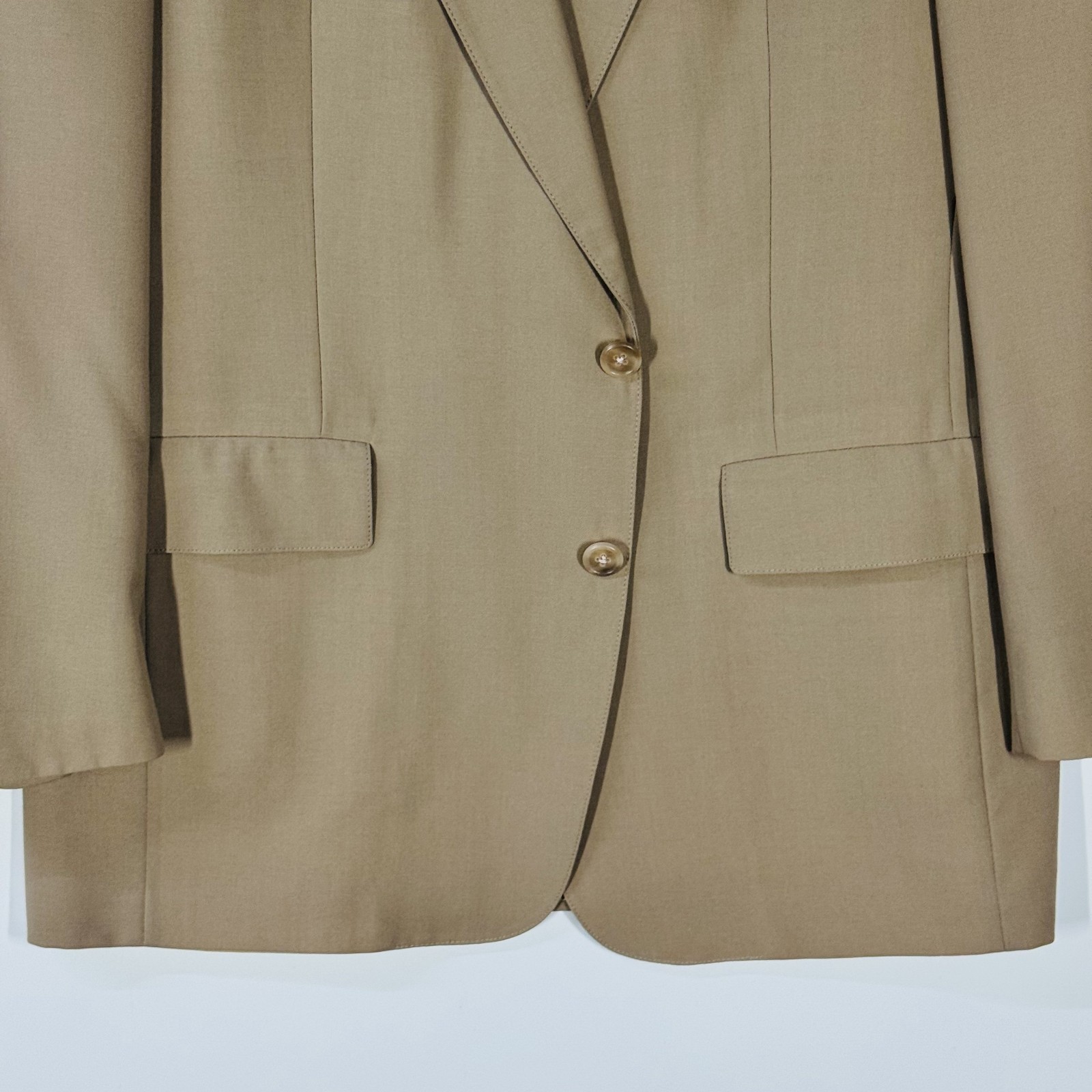 Ivory gold Austin Reed men's blazer with notch lapels, front button closure, and two front flap pockets, USA made label visible.