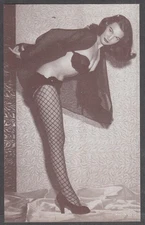 Pin-up arcade card b&w print 1940s leans forward fishnets heels black bra