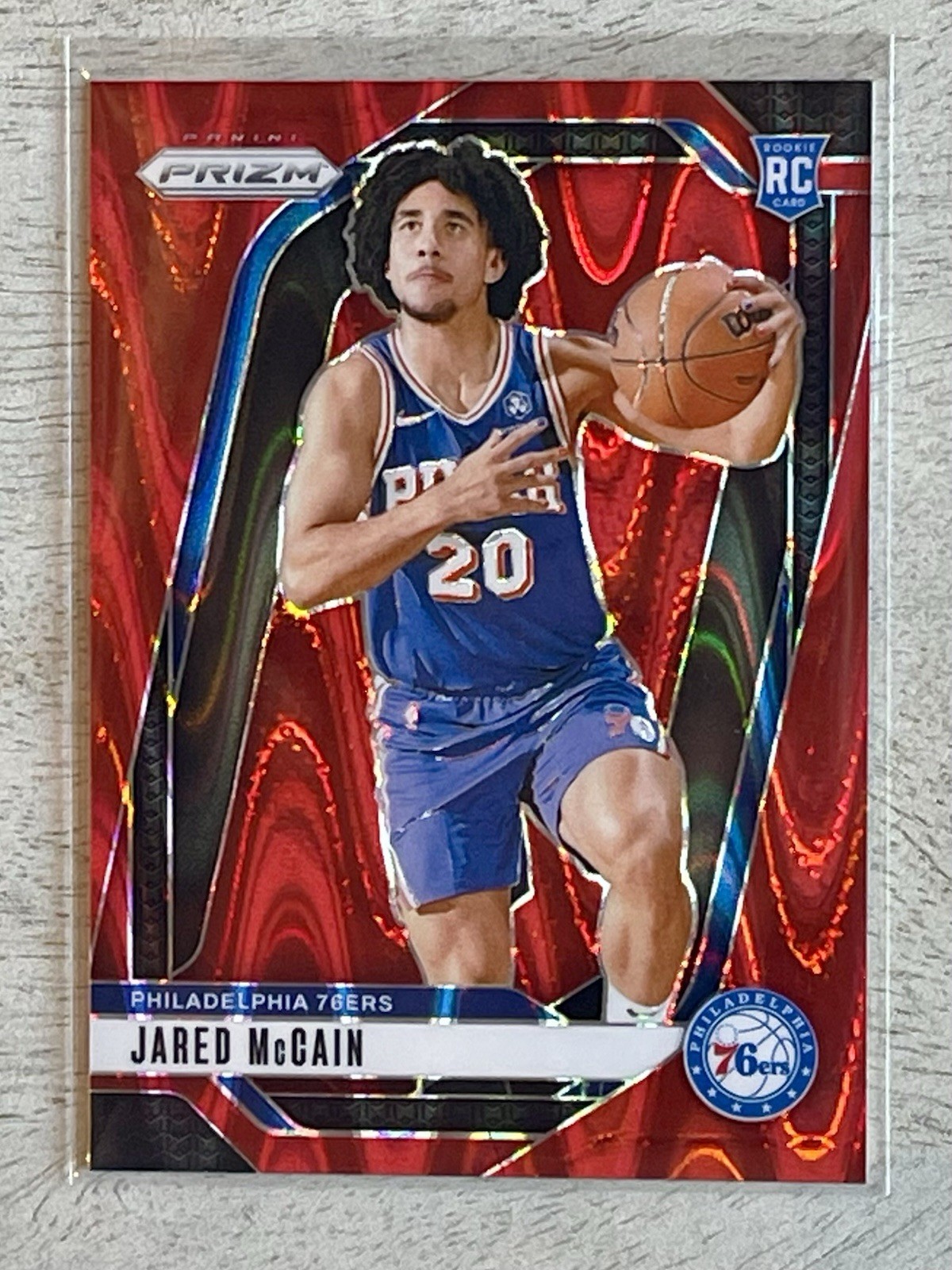 2024-25 Panini Prizm Jared McCain #222 Red Seismic /299 Rookie 76ers