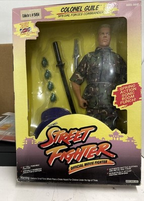 Hasbro Toys Street Fighter Colonel Guile In Box  Box Has Wear / Plastic Lose