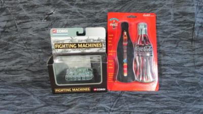 Two Unopened Items Coca Cola Tin w/ Roller Pen, Corgi Fighting Machine Tank