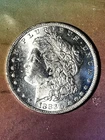 1883 o Morgan $ ch bu  + ( AG $100 T OZ?))