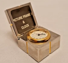 Gift mini clock with silver picture frame hidden inside gold trim