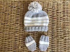 BRAND NEW HAND KNITTED GREY AND CREAM STRIPES POM POM AND MITTS IN SIZE NEWBORN