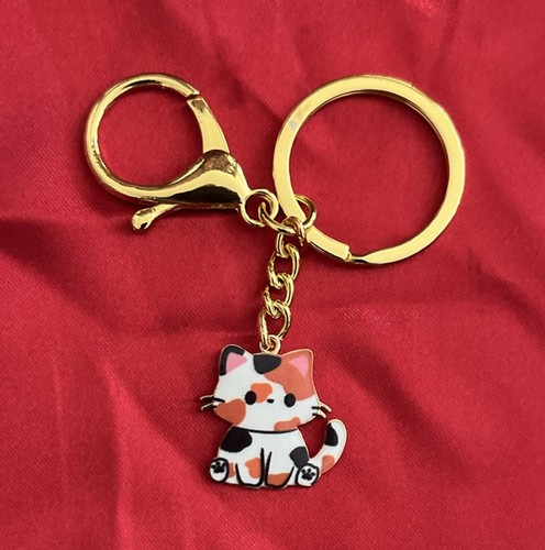 NEU DELUX CALICO KATZE GOLDENER SCHLÜSSELANHÄNGER UND PLÜSCHBEUTEL KARABINERVERSCHLUSS NEU IN VERPACKUNG