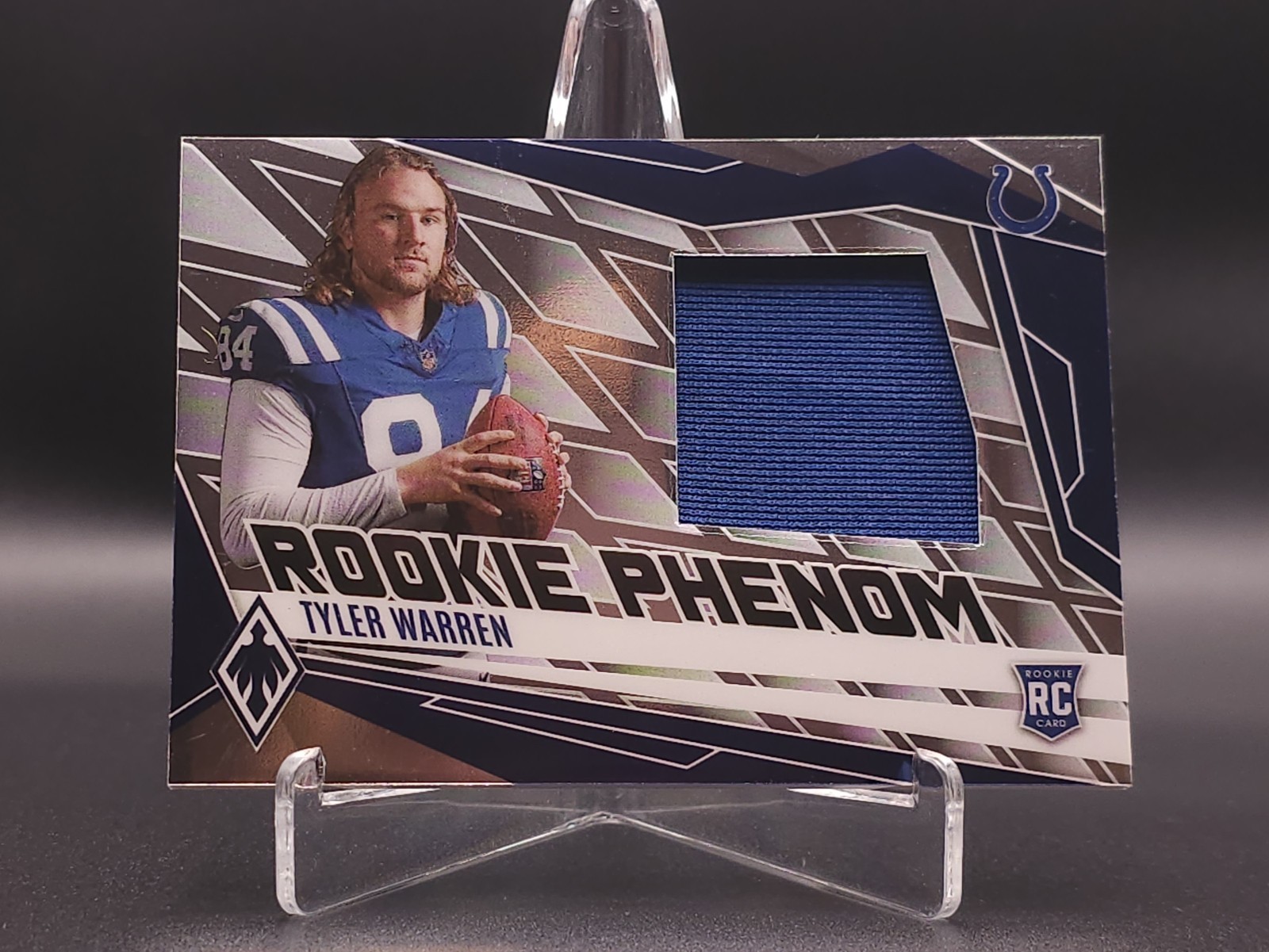 2025 Panini Phoenix - Rookie Phenom Jersey Tyler Warren #PJY-TWN /699 (MEM, RC)