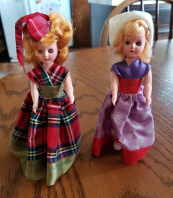 VINTAGE 2 HARD PLASTIC DOLLS IN ETNIC DRESSES, OPEN & SHUT EYES  6 1/2'' TALL