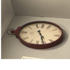 Red Oval Metal Analog Wall Clock with Roman Numerals