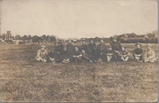 Military RPPC Postcard Soldiers Sitting in Field  WWI 