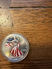 1999 colorized American Silver Eagle United States liberty silver dollar
